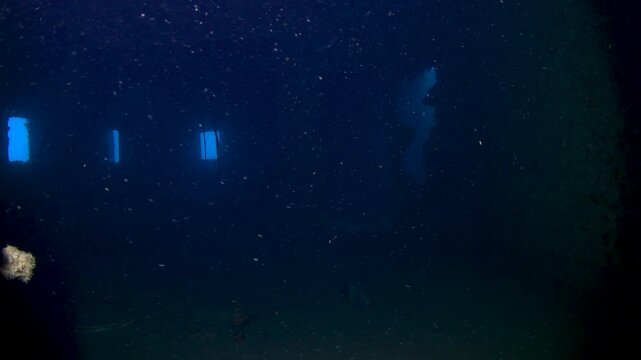 Slow Approach to Dark Entrance of Underwater Shipwreck With Blue Light Inside Near Colombo Sri Lanka