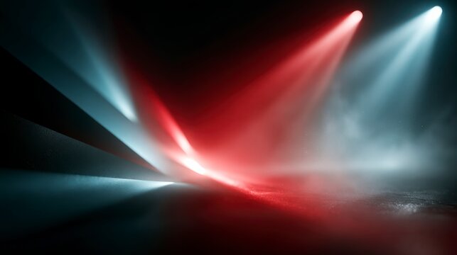 Abstract lights beam in red and blue hues, creating a dynamic and misty visual effect on a dark surface.