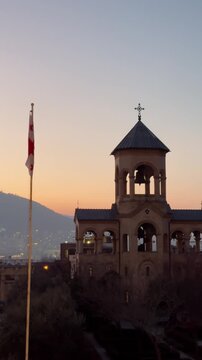 Georgian Church Dome and National Flag at Twilight Vertical Video