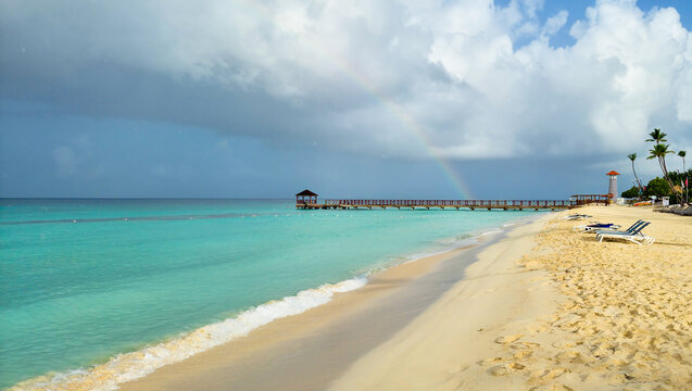 Dominicus beach after rain, white sand beach and dark sky. Dominican republic
