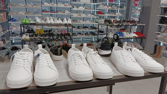 Tbilisi, Georgia - July 12, 2026: Shop display of a lot of Sports shoes on a wall. Modern new stylish sneakers running shoes for men and women Nike jack & jones Adidas brand