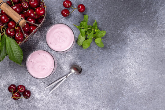 Cherry yogurt glasses with fresh fruit and mint