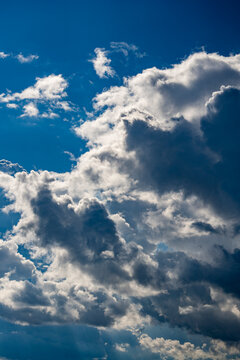 Beautiful dramatic blue sky with contrasting fluffy white and storm clouds. Natural background template for weather forecast, freedom concept, spiritual designs, or travel banners