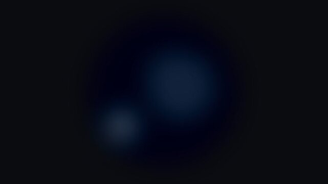 A subtle blue light glow emerging from the deep darkness of the night