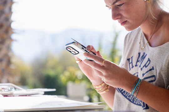 young woman artist working on a watercolor drawing outdoors