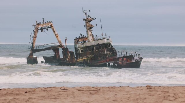 Rusted abandoned shipwreck beached on the Skeleton Coast of Namibia