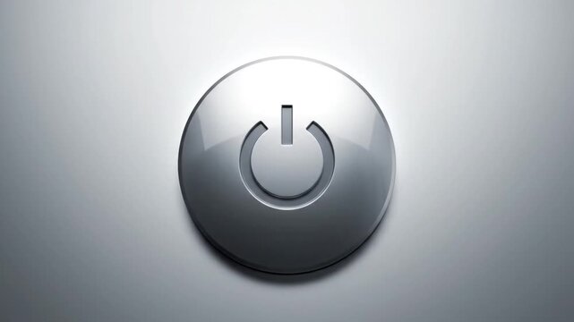 A metallic power button icon on a smooth light gray background