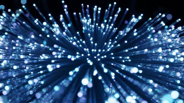 Slow motion zoom into glowing blue fiber optic cables with light bokeh effects and negative space for text placement, representing high speed data transfer and digital connectivity concept