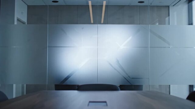 A modern empty conference room with a large wooden table
