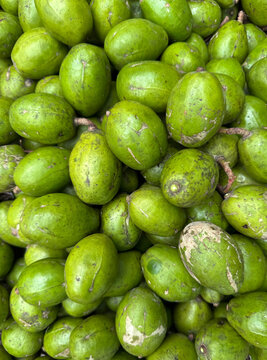 Fresh green Hog Plums (Amra) in a pile