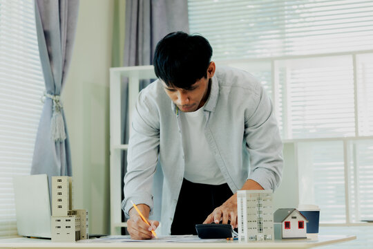 Civil engineer making precise load assessments and cost estimates for an urban development building.
