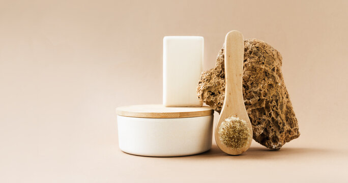Natural beauty products with brush, soap, and stone