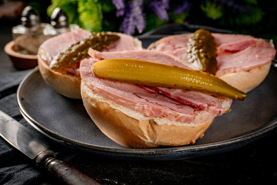 Tasty sandwich with brawn and pickled cucumber.
