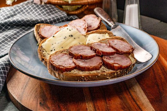 Sandwich with ham, eggs and tomato.
