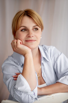 Relaxed young woman in a minimalist portrait