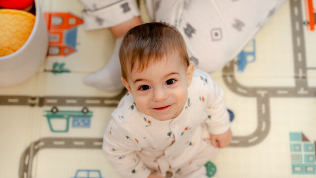 Baby enjoying quality family time on playmat