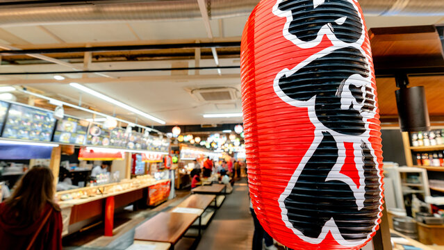 Kuromon Ichiba Market food stalls in Osaka, Japan