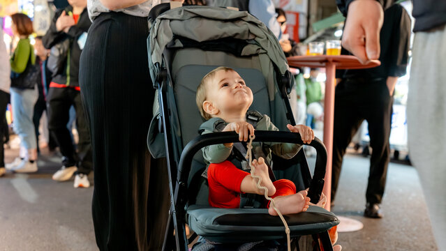 Baby in stroller at Liuhe Night Market in Kaohsiung