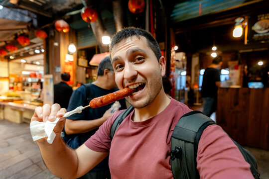 Enjoying Taiwanese street food at Jiufen Old Street