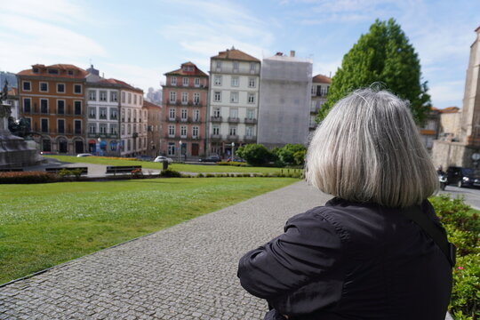 Retired woman enjoying the view in porto, portugal