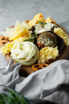 Gourmet cheese board with braided mozzarella and herb ball