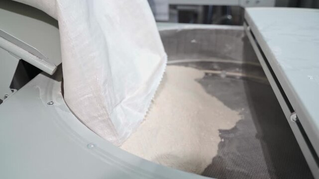 Pouring Wheat Flour into Industrial Flour Sifter
