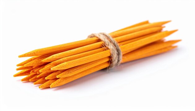 Manicure nail care sticks: A small bundle of natural wooden orange sticks for cuticle care, isolated on a clean white background.