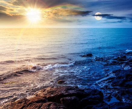 sea coast with stones and rocks. day meet night. summer vacation background at twilight. sun and moon in harmony over seascape with rough terrain. relaxing at the sea. coast of bulgaria wallpaper