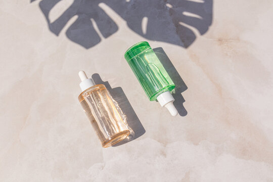 Minimal skincare serum bottle with tropical leaf shadow