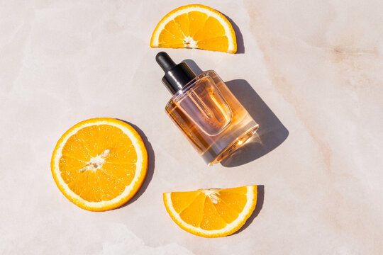 Vitamin C skincare serum bottle with fresh orange slice