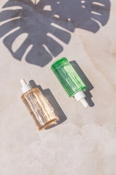 Minimal skincare serum bottle with tropical leaf shadow