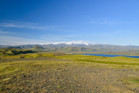 Grassy volcanic headland with coastal lagoon