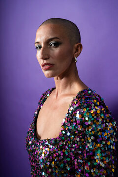Fashion portrait of shaved head middle aged woman model