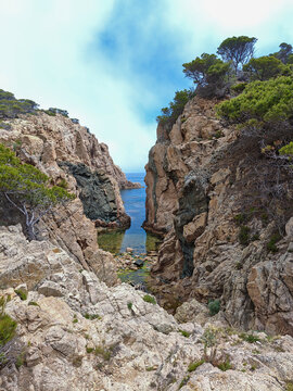 Rocky mediterranean coast forming a secluded cove