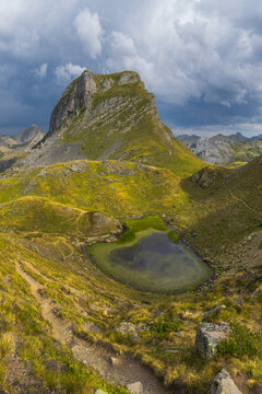 Alpine lake and rugged peak at Lacs dAyous in Pyrenees