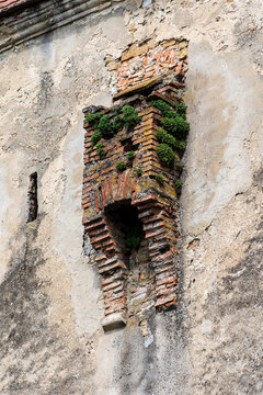 Medieval brick garderobe ruin on historic wall in Sighisoara, Transylvania, Romania.