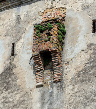 Medieval brick garderobe ruin on historic wall in Sighisoara, Transylvania, Romania.