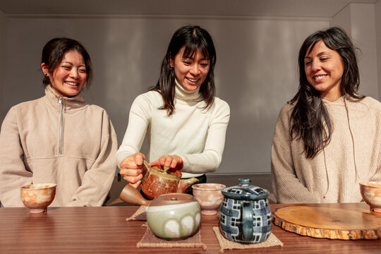 Japanese tea ritual with friends sharing warm matcha