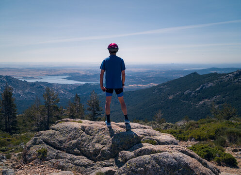 Cyclist overlooking stunning scenery in Madrid