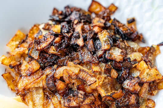 Close up of caramelized onions on white background