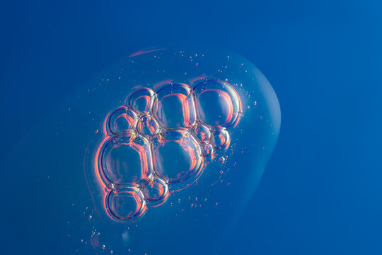 Abstract holographic serum texture with air bubbles