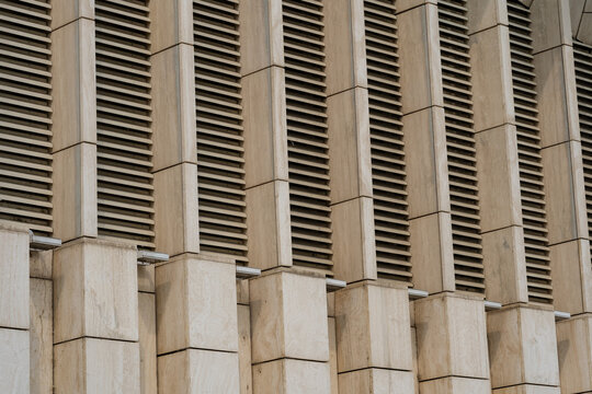 Architectural facade detail with repeating concrete louvers