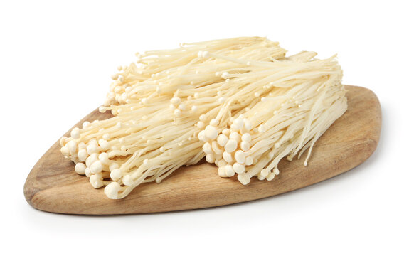 Clusters of raw enoki mushrooms isolated on white