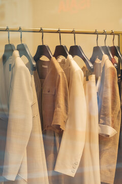 Shopwindow clothing display with jackets in mall boutique