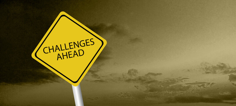 Challenges ahead sign. Black on yellow diamond background. Road safety signs and symbols.	
