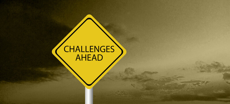 Challenges ahead sign. Black on yellow diamond background. Road safety signs and symbols.	
