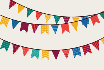 Obraz premium Colorful festive bunting garland hanging in multiple rows on a clean off white background for party decor.