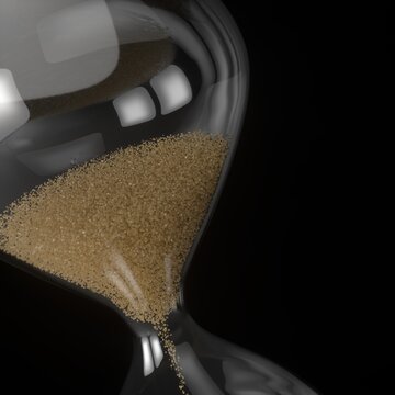 Hourglass with flowing sand on black background, closeup