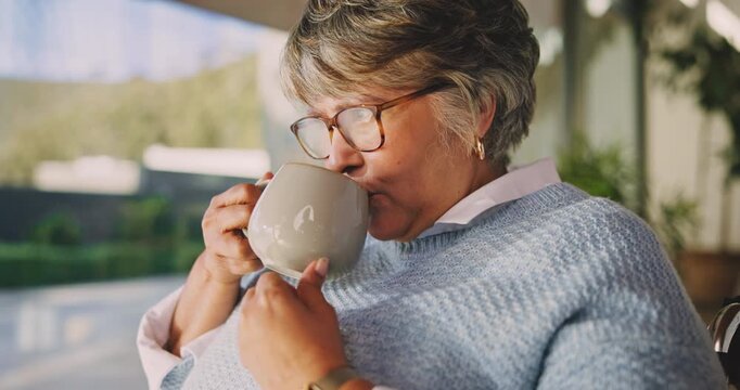 Coffee, thinking and old woman in wheelchair in home for relax, wellness and morning beverage. Retirement, drink and person with disability at house, reflection or remember past with window view