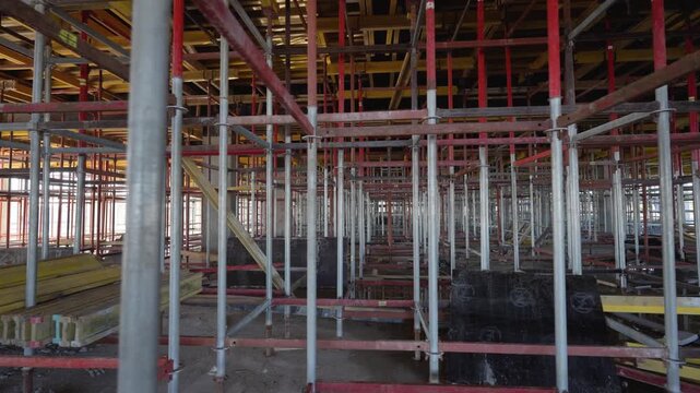 Construction scaffolding and ceiling formwork at a commercial building site